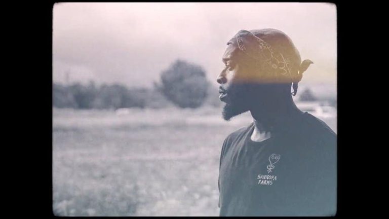 Profile shot of a man at Sankofa Farms, symbolizing the connection to sustainable agriculture and community empowerment.